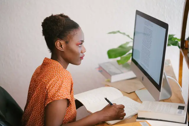 Photo Of Woman Looking On Computer - Financial Literacy Course