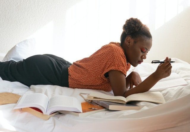 Photo Of Woman Reading Books