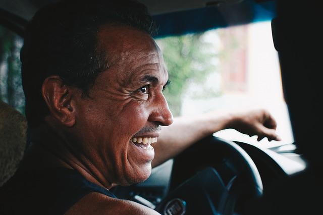 happy man driving a car