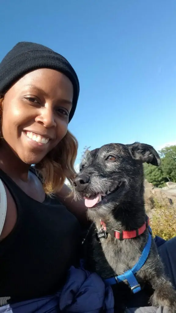 Prisca Benson, owner of OGL, and pup Sasha